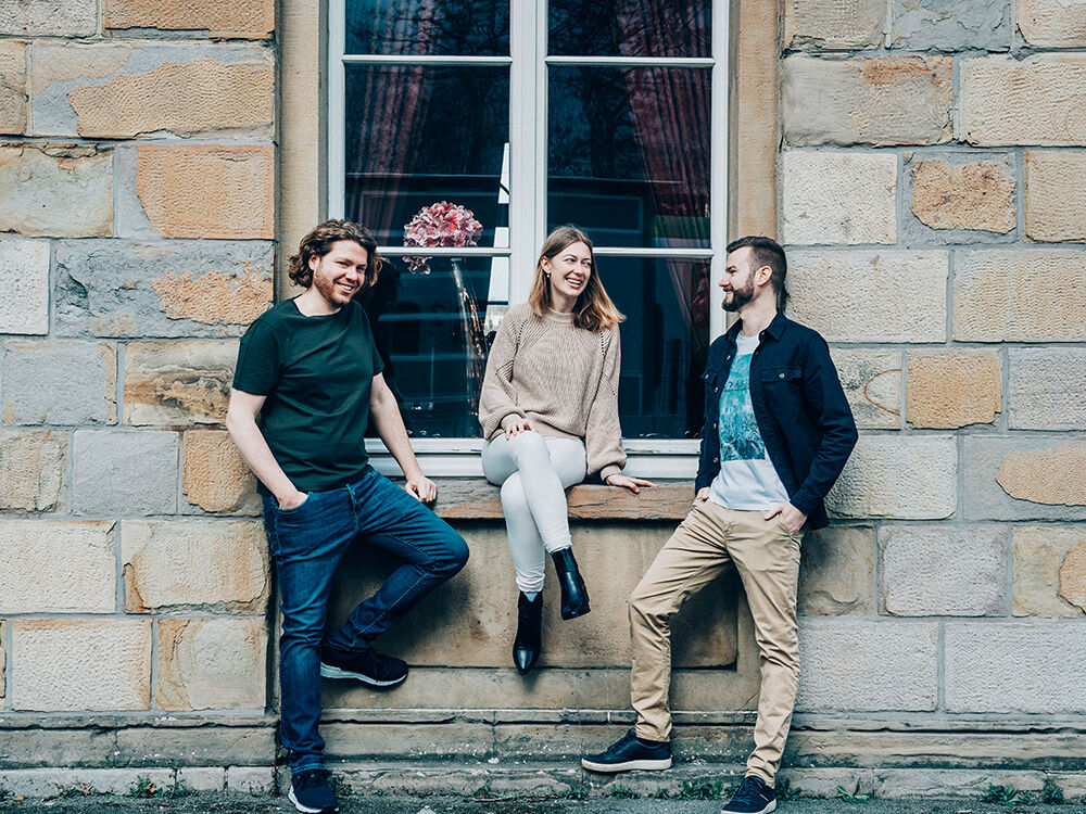 Hauke Jäger, Beraterin Vanessa Westphal und Game Designer Julius Kuschke (r.)